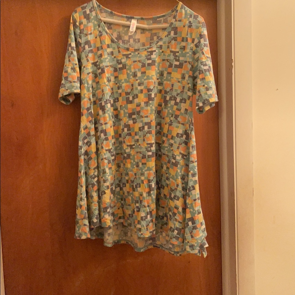 T-shirt made by LuLaRue. It is a size small.